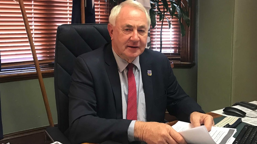 Toowoomba Regional Council Mayor Paul Antonio sits at his desk.