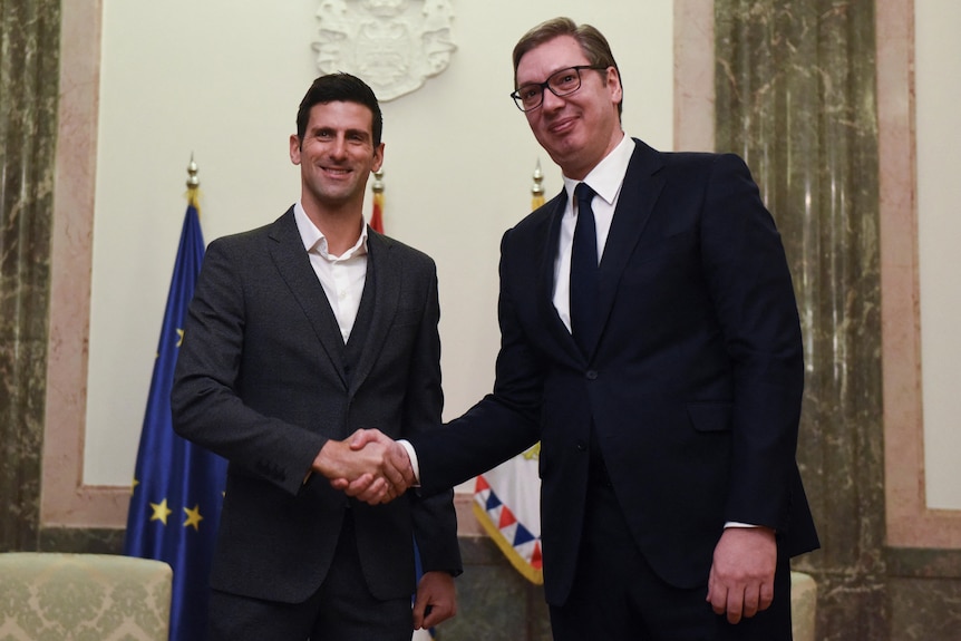 Novak Djokovic shakes hands with Serbia's President Aleksandar Vucic