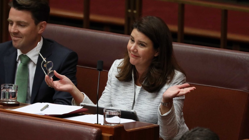 Jane Hume shrugs as she looks across the Senate