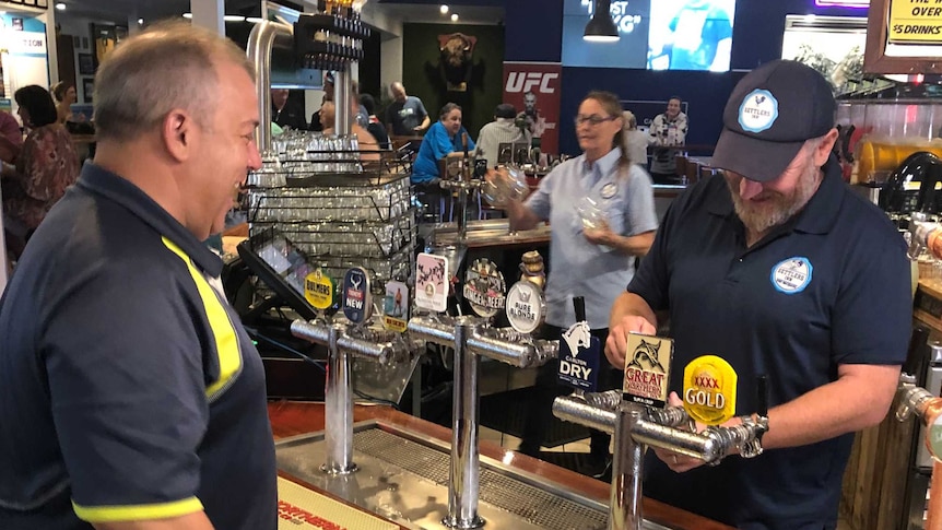 Publican pouring free beers for punters ahead of pub shutdown.