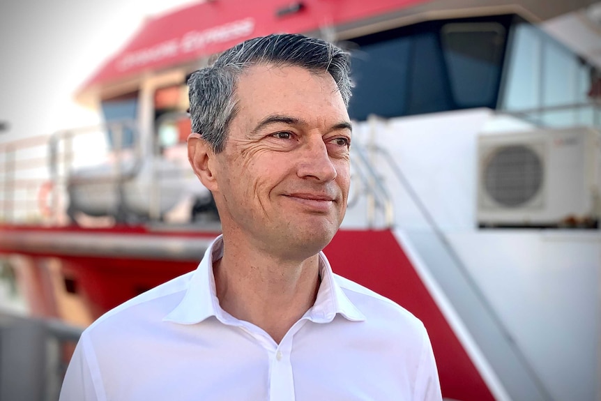 Sun Cables Australia CEO David Griffen is wearing a white shirt and smiling at the camera.