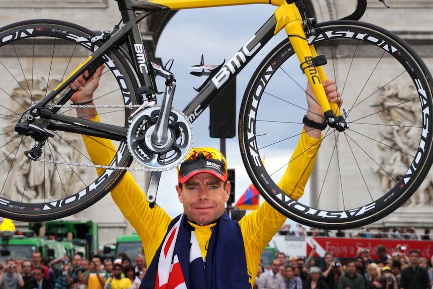 Cadel Evans celebrates after winning the Tour De France last year in Paris.