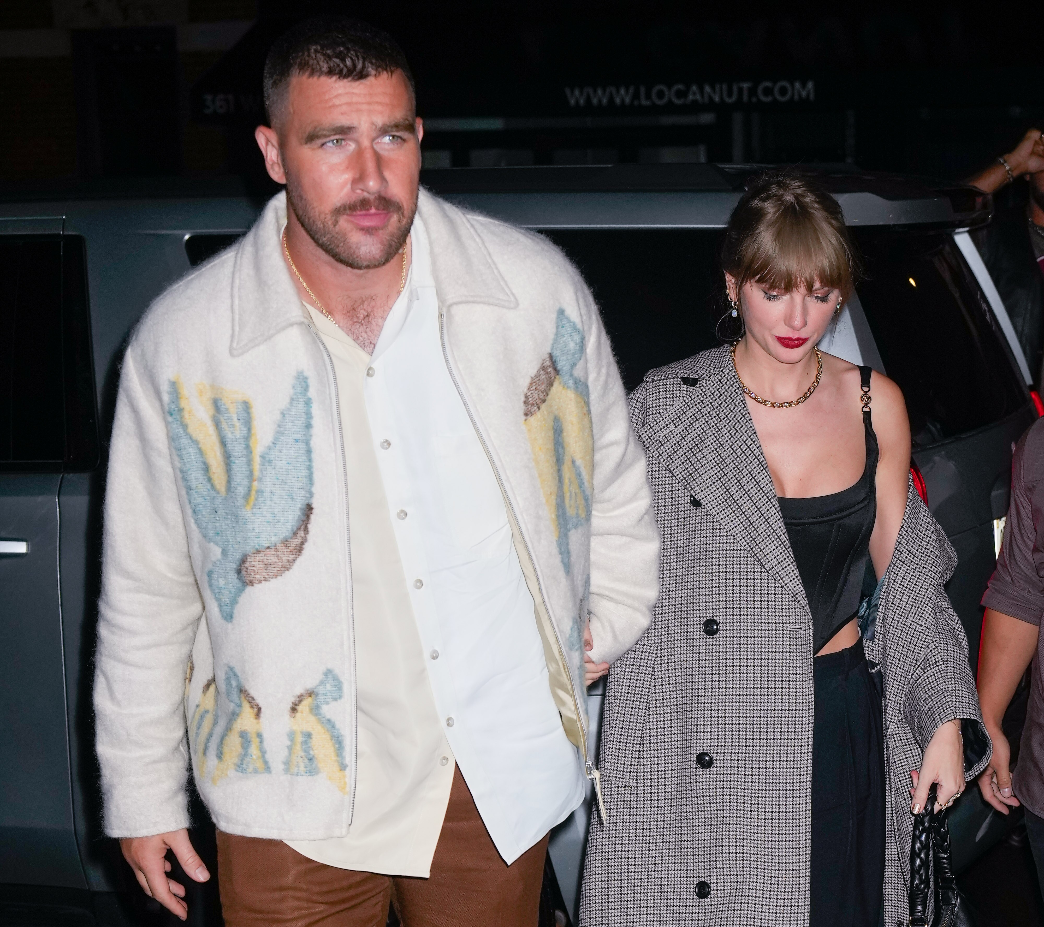 Travis Kelce and Taylor Swift hold hands