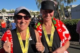 tow women with medals celebrate a win