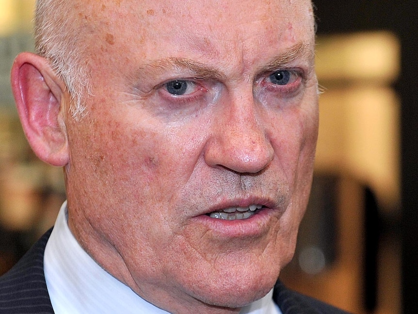 Former NSW Labor energy minister, Ian Macdonald, answers questions as he leaves the ICAC.