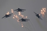 Four Russian Sukhoi Su-27 fighter jets fly in formation.