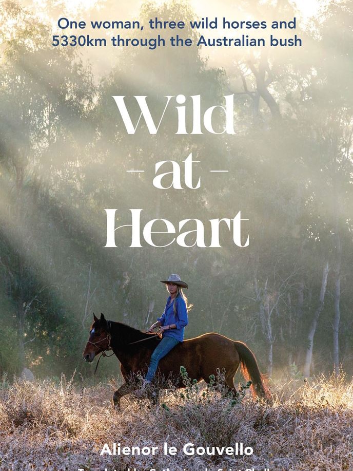 Cover of a book, titled Wild at Heart, featuring a image of a woman on a horse.