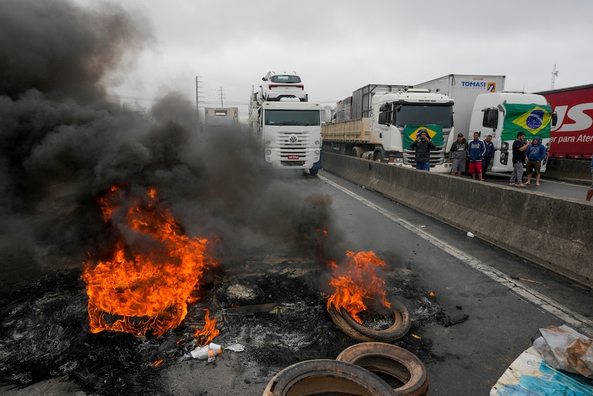 Truckers supportive of President Jair Bolsonaro block a highway to protest his run-off election loss.