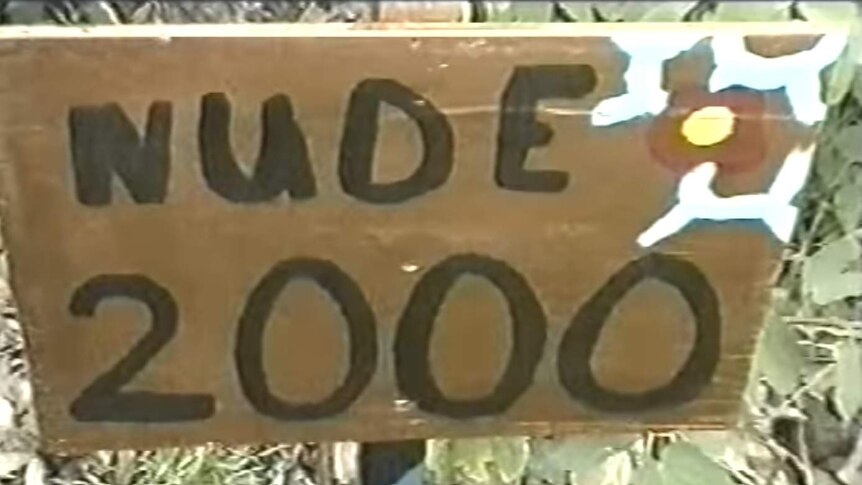 A sign saying 'nude 2000'