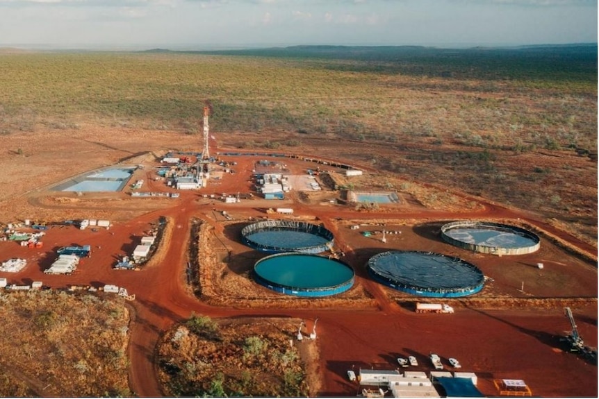 An aerial shot of a gas well on a cattle station.