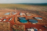 An aerial shot of a gas well on a cattle station.