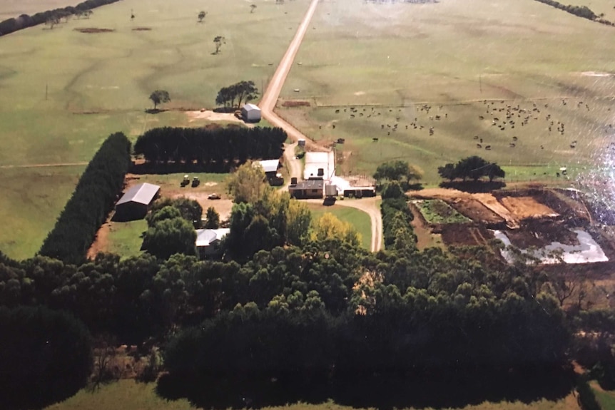 Aerial footage of the family farm before the fire, depicting a quaint farm setting surrounded by fields