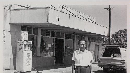 Jim Ah Toy stands in front of Ah Toy's Store in 1974.