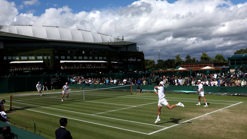 Max Purcell and Jordan Thompson during a doubles match at Wimbledon