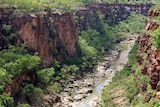 A stream runs through a large rocky gorge