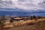 The storm rolls in over South Canberra.
