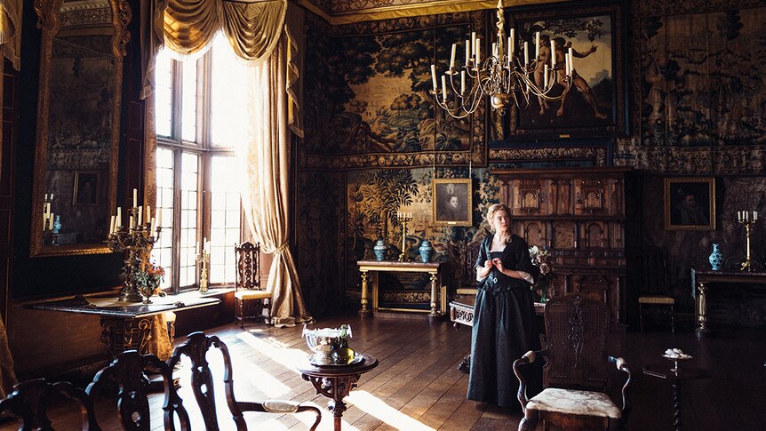 Emma Stone in intricately decorated room in 2018 film The Favourite.