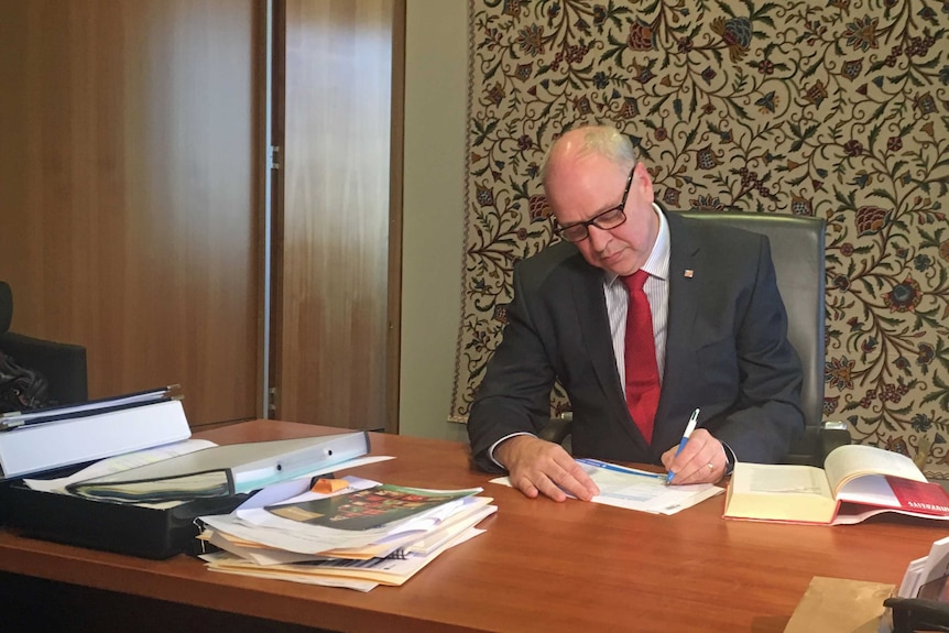 Victoria University Vice-Chancellor Peter Dawkins at his desk.