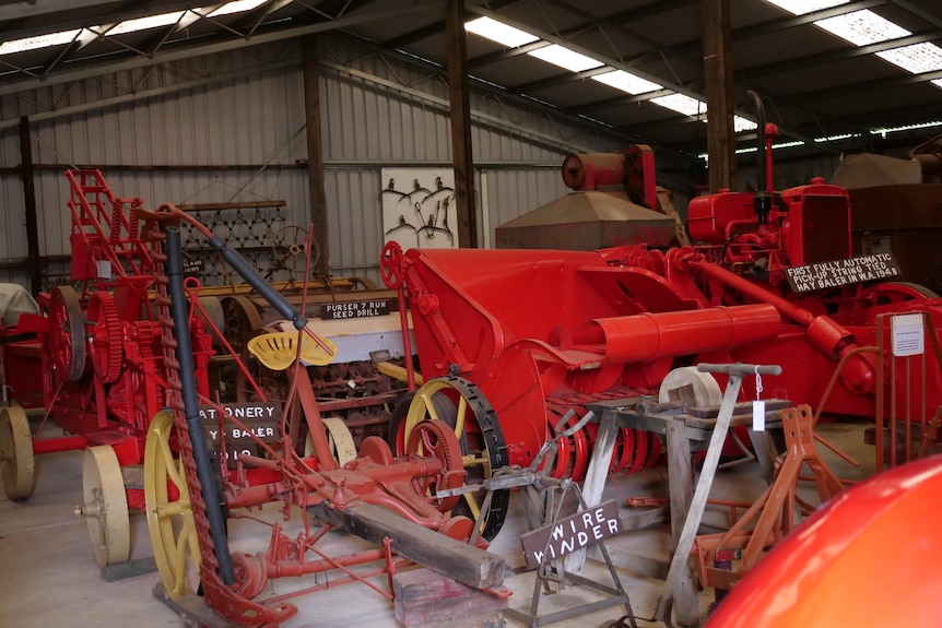 Vintage red agricultural equipment in the shed