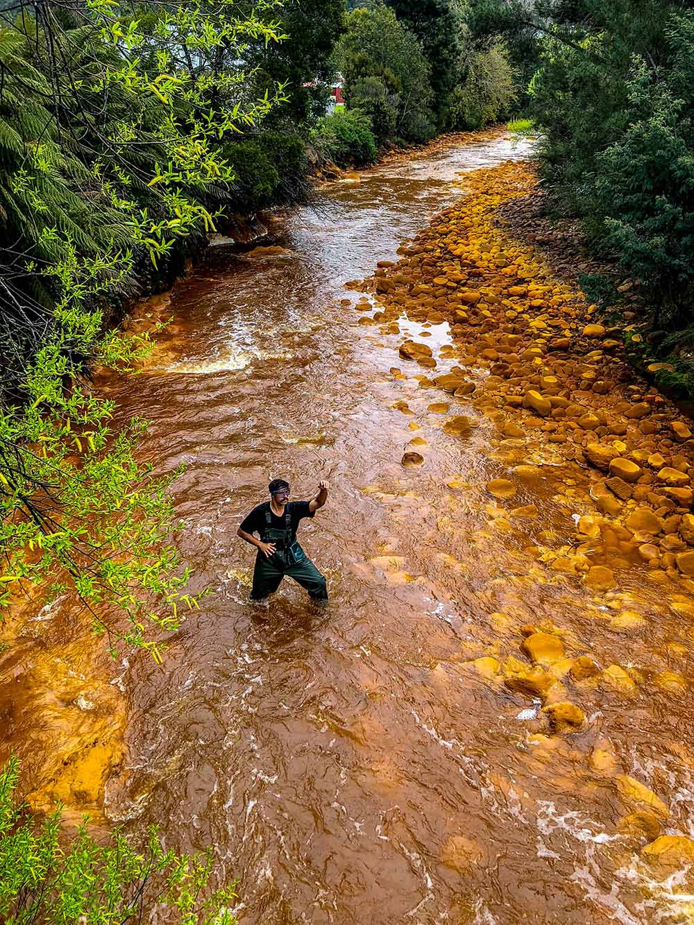 Unconformity festival dancers make splash in Queenstown's toxic orange ...