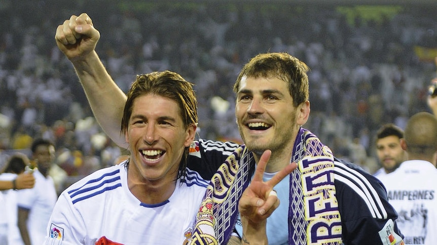 Dropsies: Senior defender Sergio Ramos (L) had a strong grip on the King's Cup after the Spanish final, but that wouldn't last.