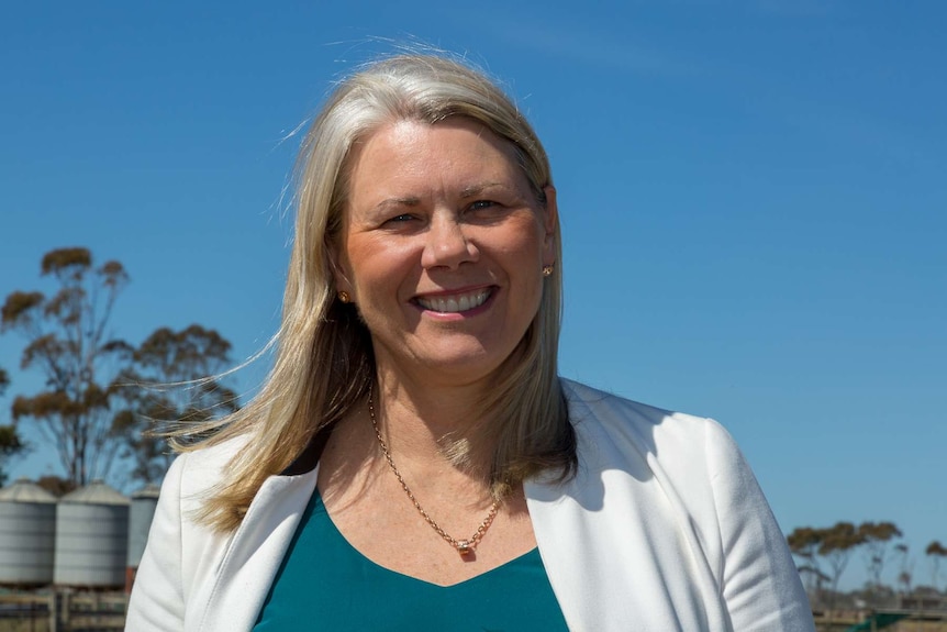 Kate Roffey stands in front of a paddock and tin shed near Werribee.