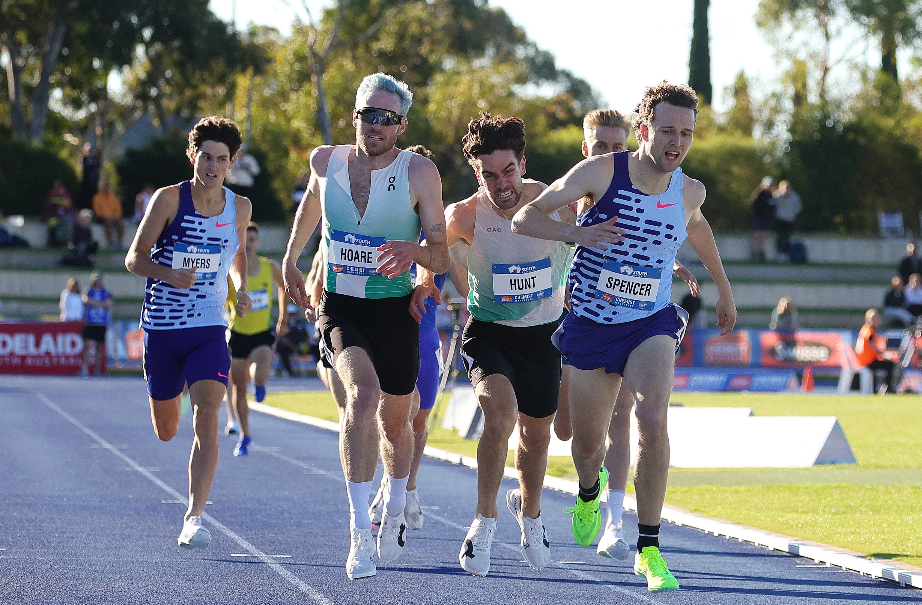 Adam Spencer stretches ahead of a pack of runners to win