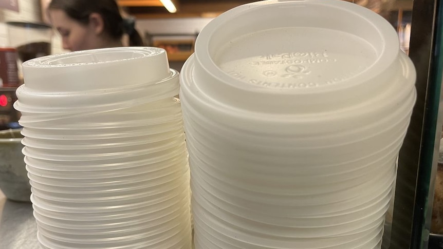 Piles of plastic takeaway coffee cup lids