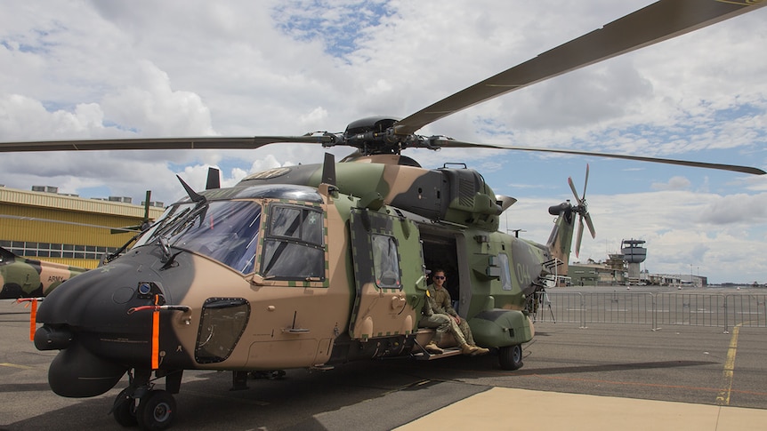 A Taipan helicopter sits on the tarmac at the Oakey Army Aviation base.