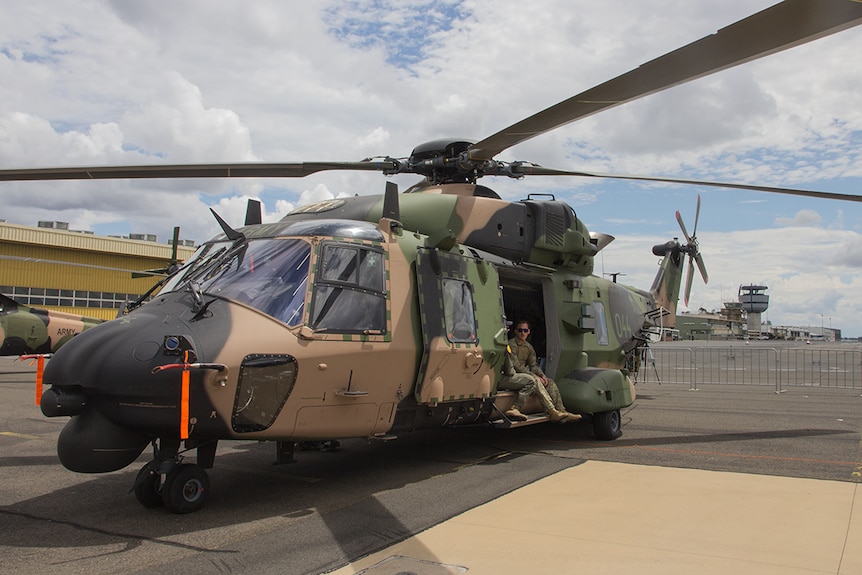 A Taipan helicopter sits on the tarmac at the Oakey Army Aviation base.