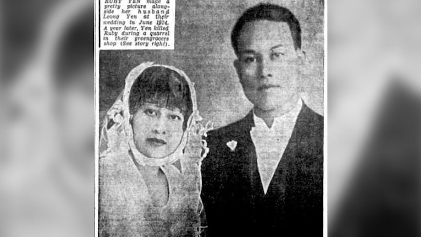 An old photograph of a Chinese man and woman in bridal attire