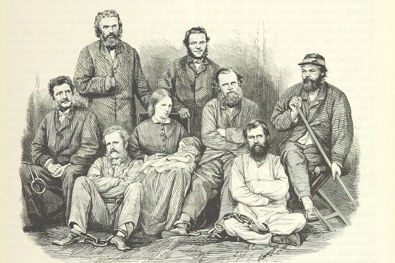 Black and white illustration of older English men in shackles alongside a woman holding a baby