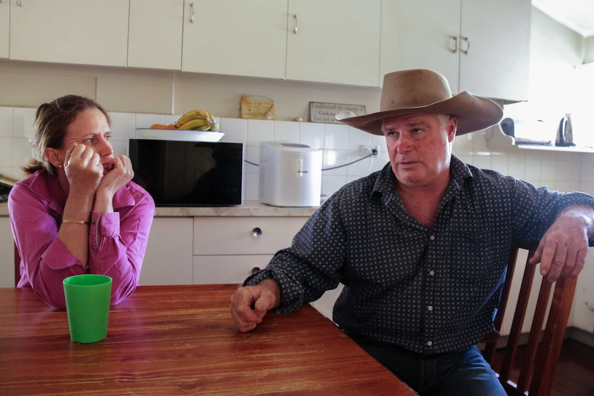 Amanda Howard and Bill Prow sitting inside