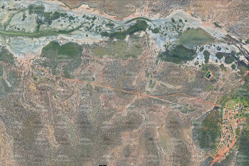 An aerial map of a remote community with rivers surrounding