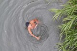 Man swims in river in New Taipei City