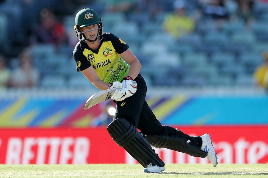 Meg Lanning sets off on a run wearing cricket kit