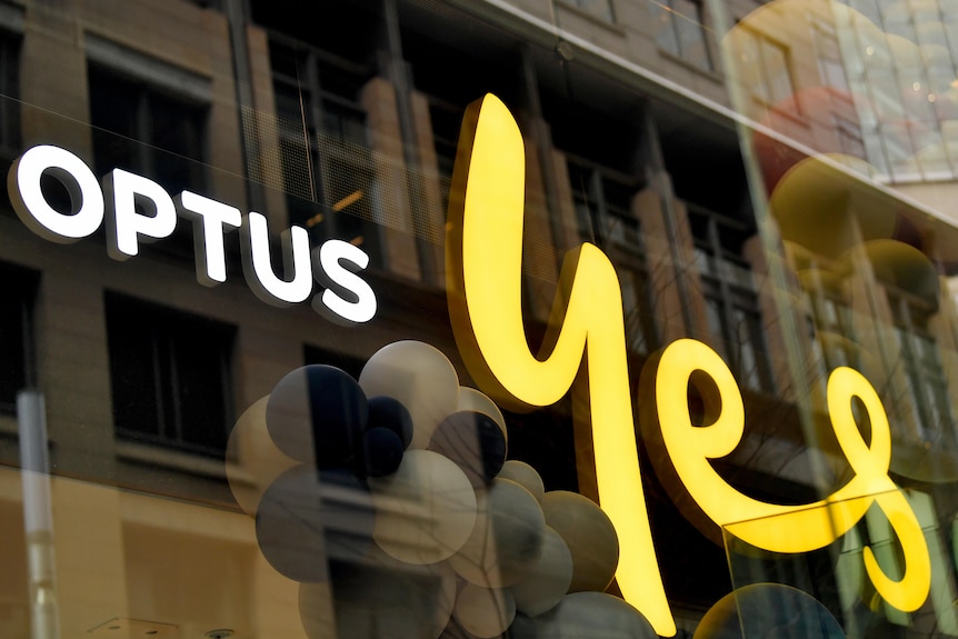 optus 'yes' sign on glass fronted office block