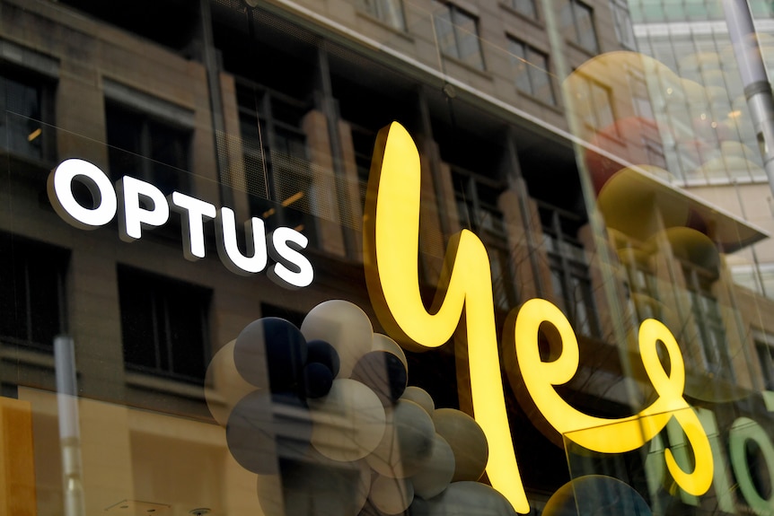 optus 'yes' sign on glass fronted office block