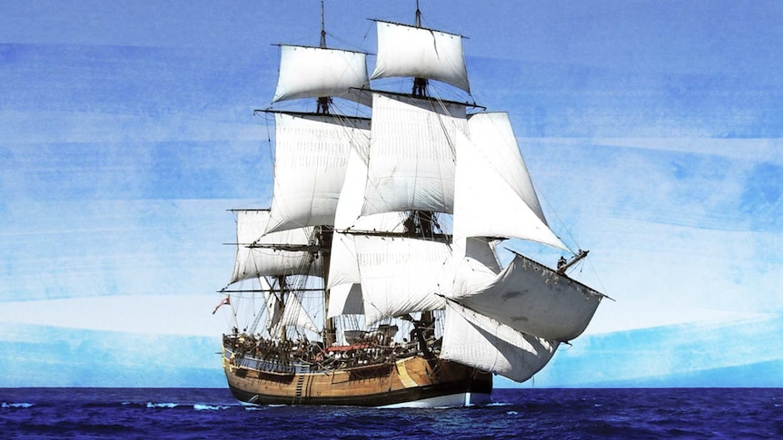 A tall ship on the ocean with all sails open.