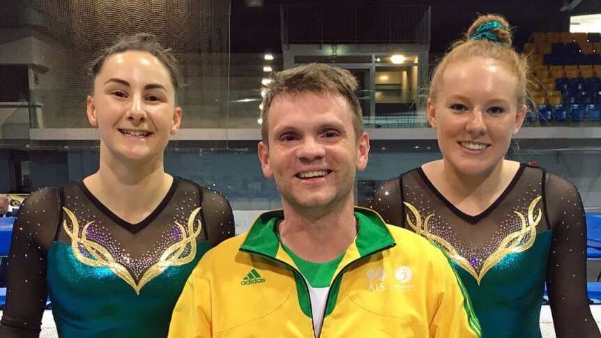 Trampoline athletes Claire Arthur and Cassie Hoare with their coach Viktor Zhuravlev.