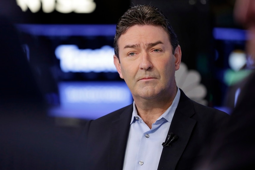 Steve Easterbrook sitting in a studio dressed in a suit.