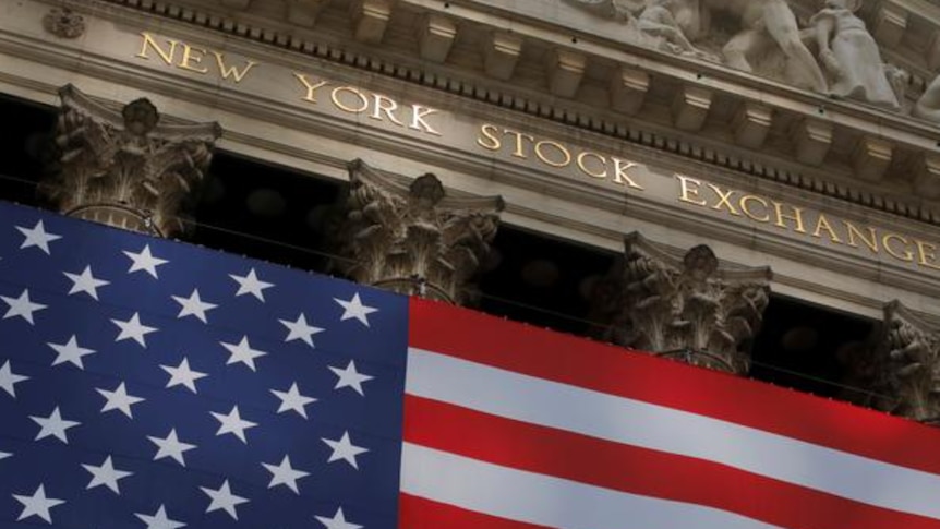 A US flag flies outside Wall Street at the  New York Stock Exchange