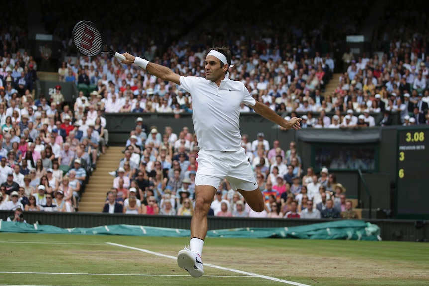 Switzerland's Roger Federer makes a backhand return to Croatia's Marin Cilic at Wimbledon.