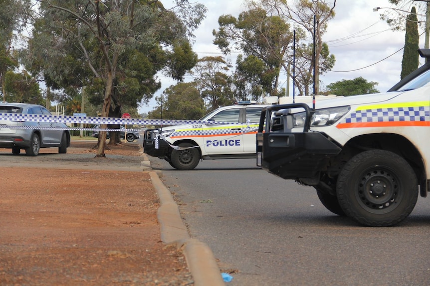 Police vehicles and police tape surround a regional property.