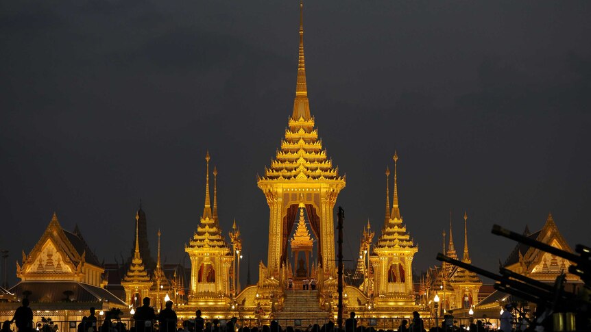 The Royal Urn is seen inside the Royal Crematorium, a golden structure 50-metres tall with 9 ornate spires.