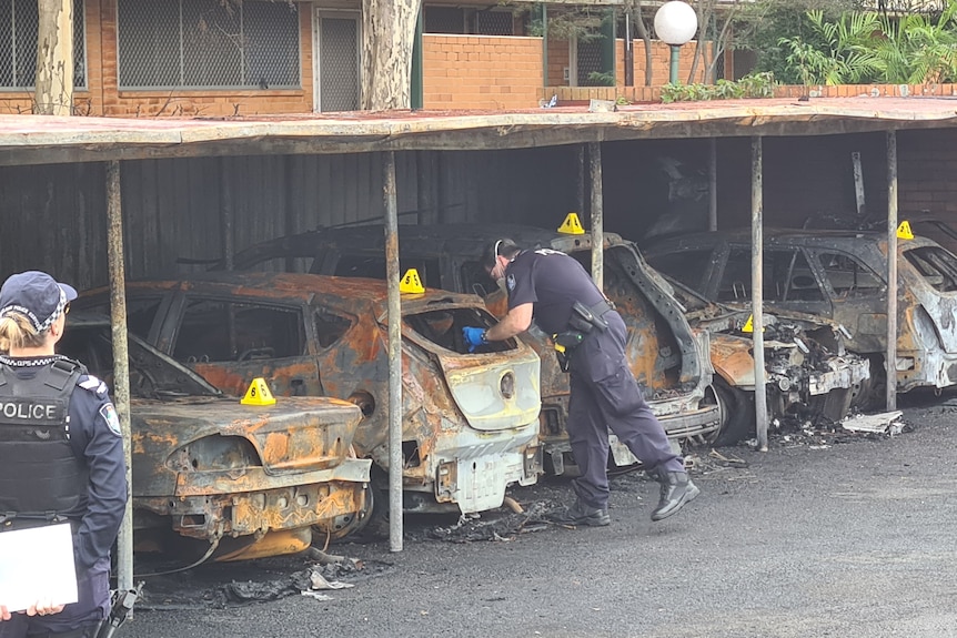 Burnt cars in a garage 