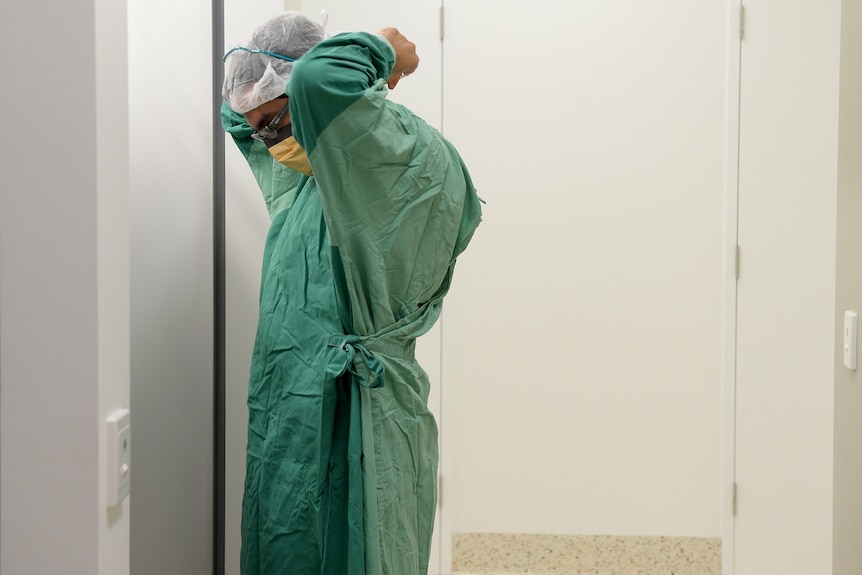 A Sydney surgeon prepares for theatre  at Liverpool Hospital