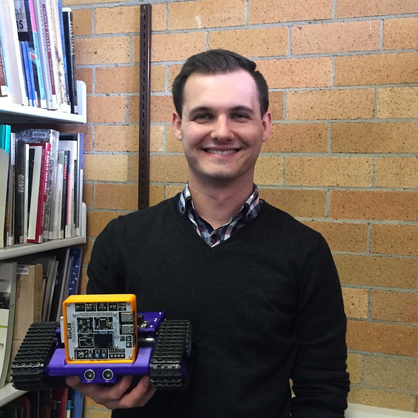 Andreas Antoniades from Obelisk Systems, with one of the rovers used in the StarLAB program.