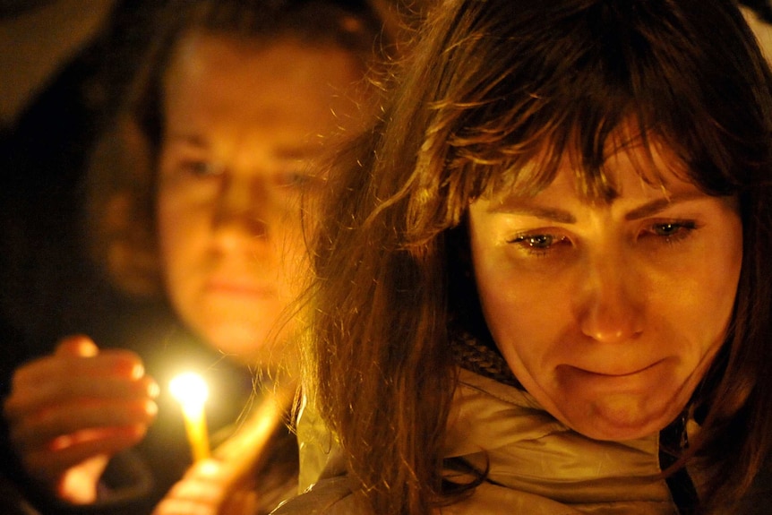 A woman reacts in central Saint Petersburg