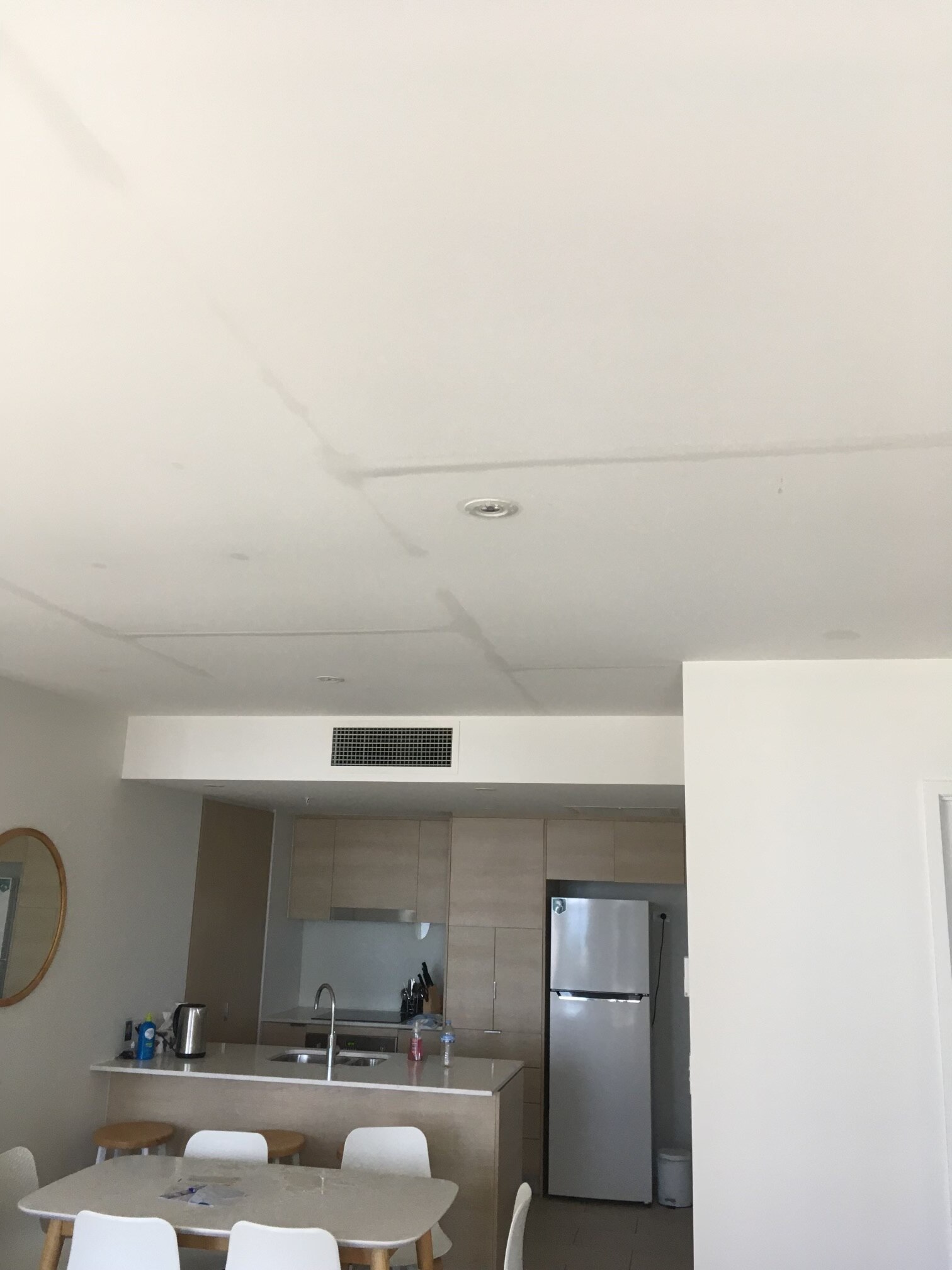 lines on the ceiling show water leaking from the apartment above